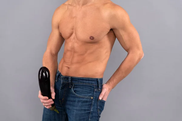 Confident, fit man showing peak male vitality